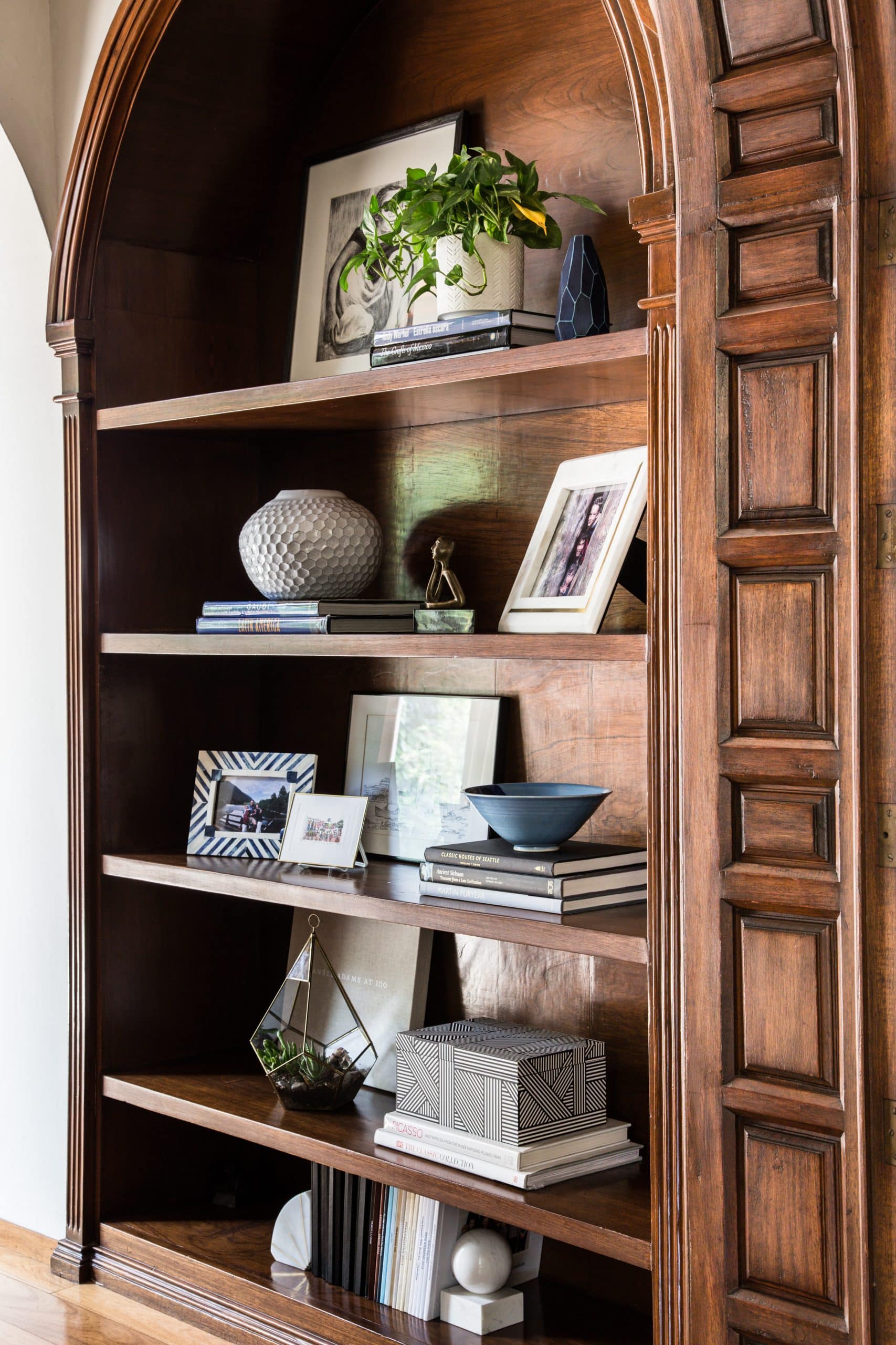 Curated shelf styling with objects and books