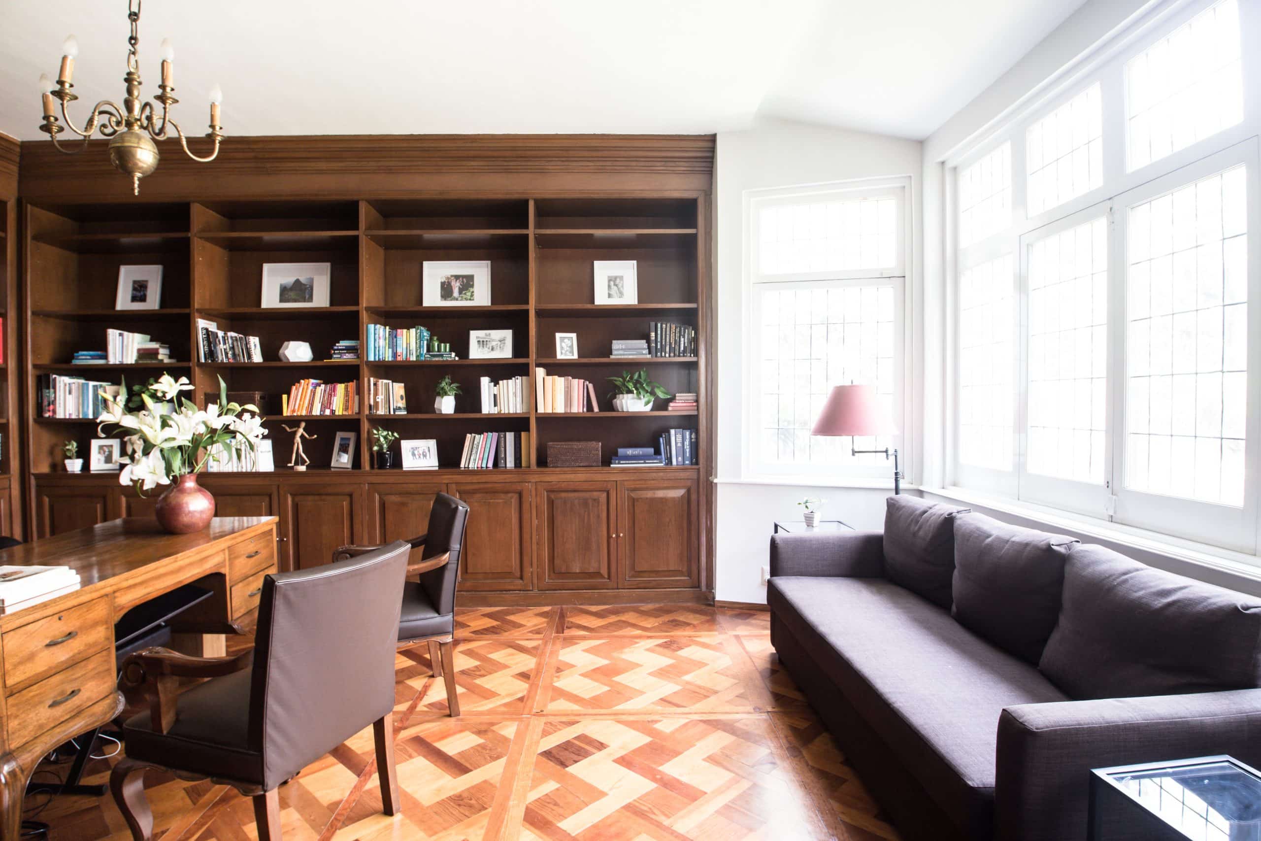 Study with built-in bookshelves over a parquet floor